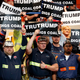 A group of coal miners wave signs for Donald Trump.